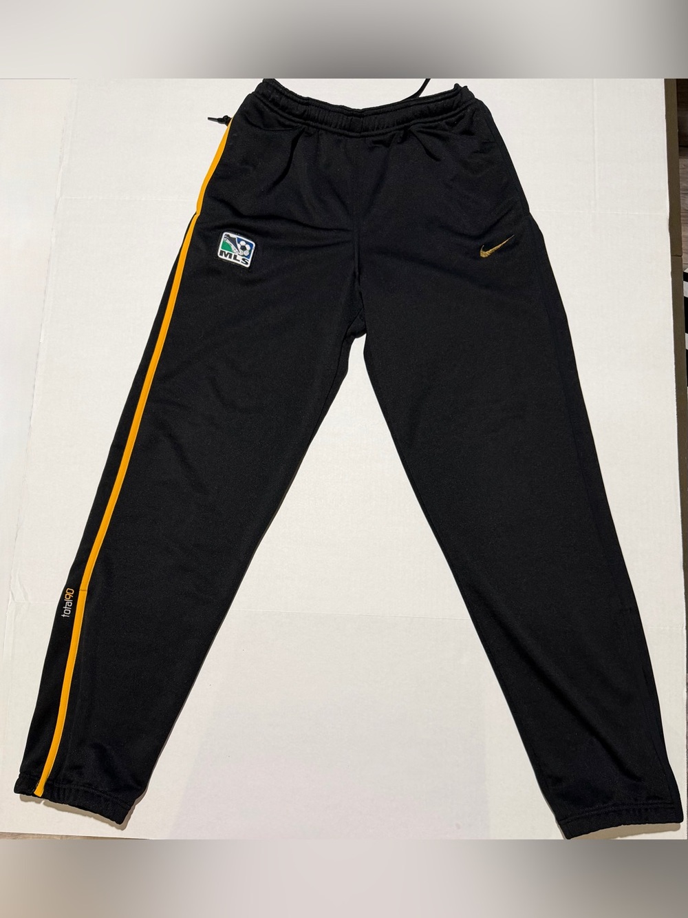Nike Black Joggers with Yellow Side Stripe and Gold Swoosh
